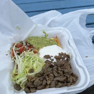 a meal in a styrofoam container