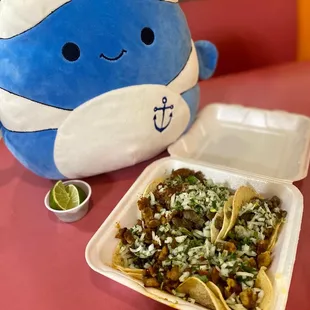 a plate of nachos and a plush toy