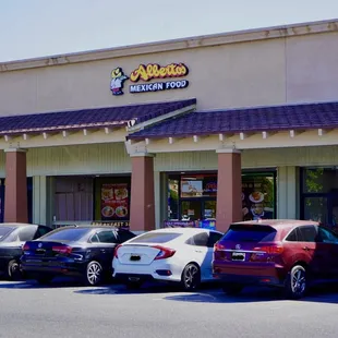 cars parked in front of the restaurant