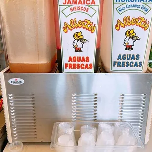 three containers of hot sauce