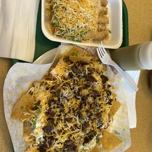 Asada nachos and 5 rolled taquitos