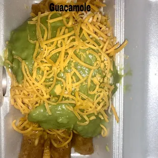 3 rolled tacos with guacamole