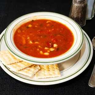 a bowl of soup and crackers