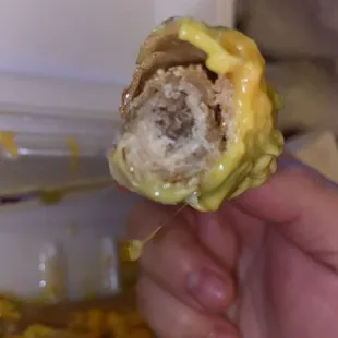 Hard and stale roll taco with a tiny amount of meat.