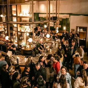 a crowd of people at a bar