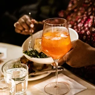 a glass of wine and a plate of food