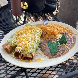 Rolled tacos, rice and beans.