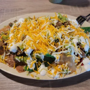 Carne asada nachos . Really good. They have full and half sizes. This is the half size