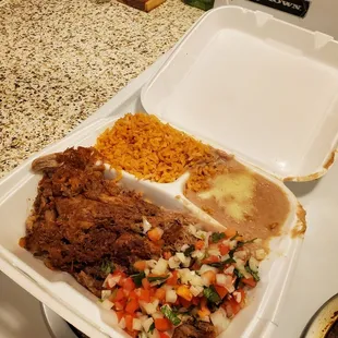 a meal in a styrofoam container