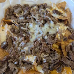 Asada nachos guacamole on the side