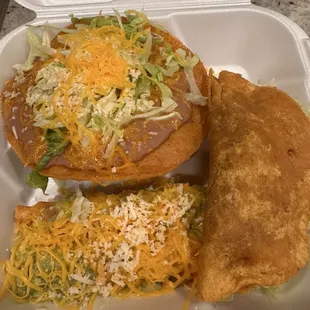 Two rolled tacos, beef taco, and bean tostada