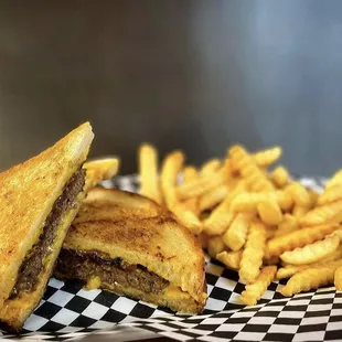 a grilled cheese sandwich and french fries