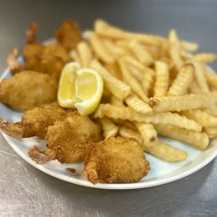 a plate of fried shrimp and fries