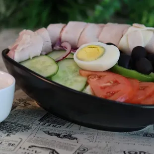 a bowl of food and a cup of coffee