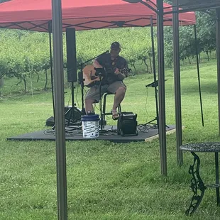 a man playing a guitar