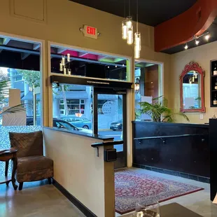 a view of a dining room with a bar