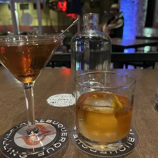 Old fashioned with rum and Single-Malt Manhattan. Gilbert Uribe rocking it in the background.