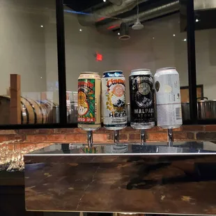 several cans of beer on a counter