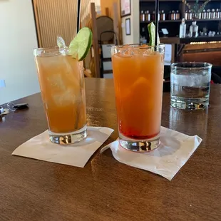 two cocktails on a bar