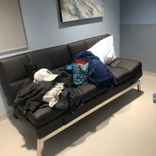 Modern futon, luxurious throw and pillows so family can stay comfortably.