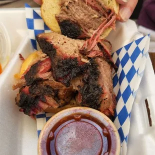 Sliced BBQ beef brisket sandwich