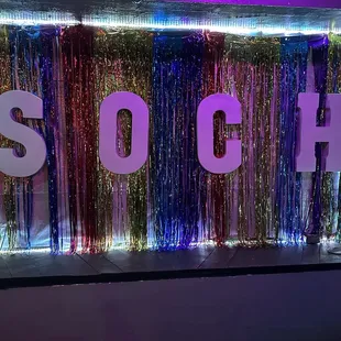 the word soch on a neon sign