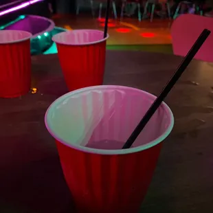 red cups with straws in them