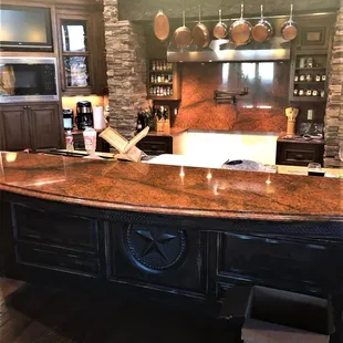 a kitchen with a bar