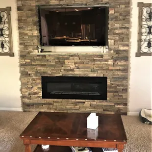 a living room with a fireplace