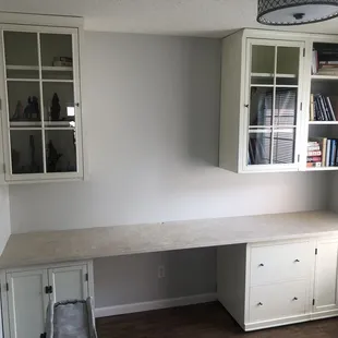 a corner desk in a home office