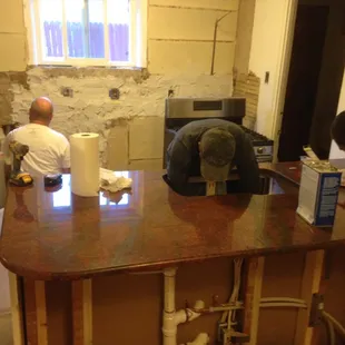 Marcos installing granite and undermount sink.