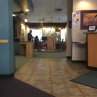 The office is homey. View is from the seating area straight across to the glasses area.