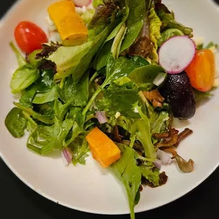 a plate of salad on a table
