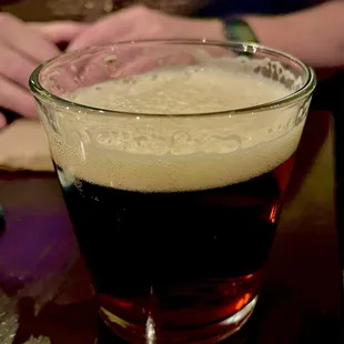 a glass of beer on a table