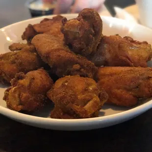 a plate of fried food on a table