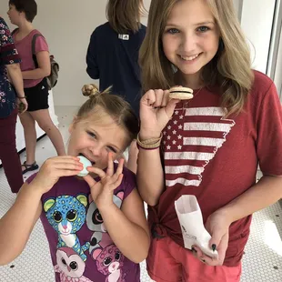 two girls brushing their teeth