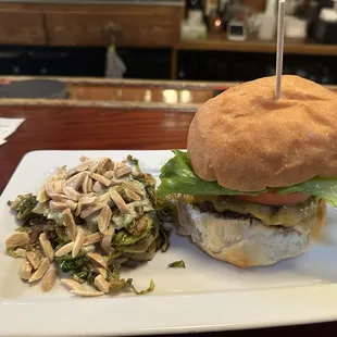 Apple Rum Burger with side of roasted Brussels sprouts with sauce and almonds.