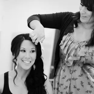 Nikole putting the finishing touches on my wedding day hair.