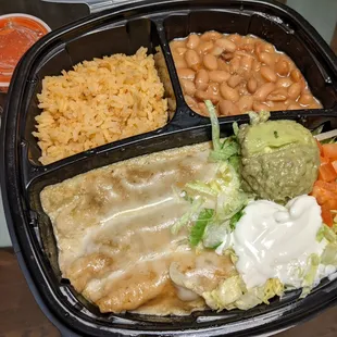 Chicken and beef enchiladas in mild a green sauce, served with rice, beans, guac and sour cream. This was solid.