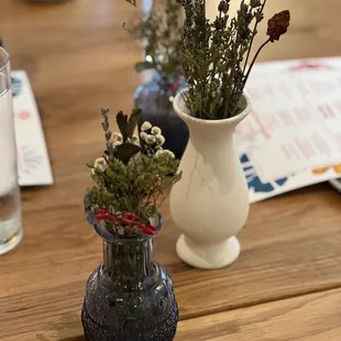 vases of flowers on a table