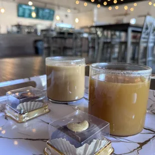 Yemeni latte with peanut butter stuffed date (background) and Qishr with honey and mixed nuts stuffed date (foreground)