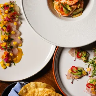 a variety of plates of food on a table