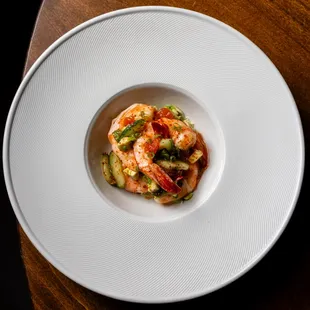 a plate of food on a wooden table