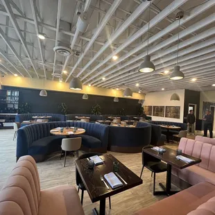 a restaurant with a large couch and tables