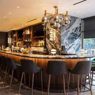 The Alder &amp; Ash lounge has seating for 18 at the counter and can accommodate happy hour groups of all sizes.