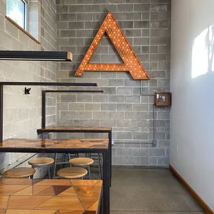 a brick wall with a triangle on it
