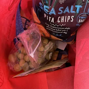 Cashiers put stuff on top of another bag of pita chips- no my favorite move guys.