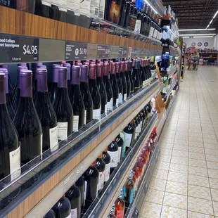rows of bottles of wine in a store
