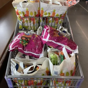 a shopping cart full of groceries