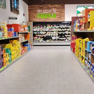 a grocery store aisle with a variety of products